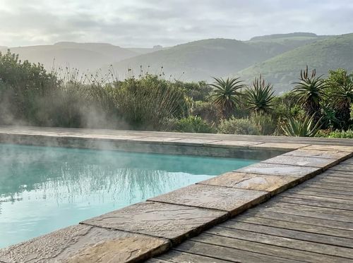 Heated pool steaming on a cool morning